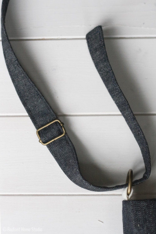 grommet detail strap bag